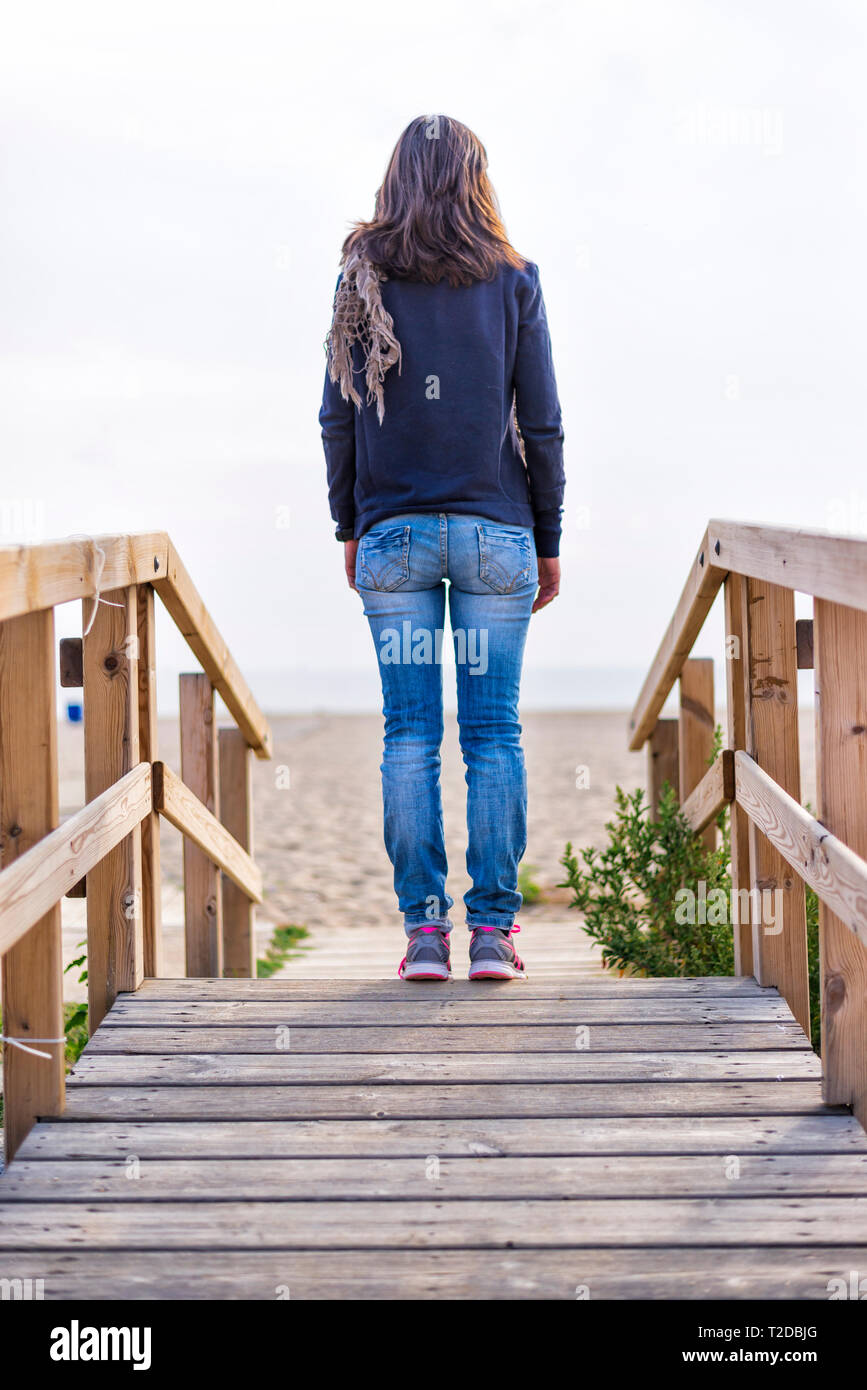 Trendy woman standing rear view hi-res stock photography and images - Alamy