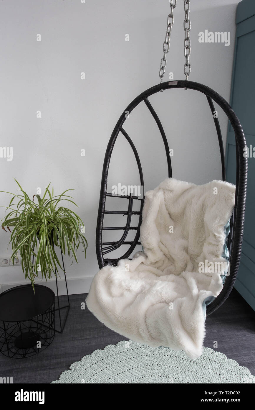 Hanging wicker chairs for relax time in the room, modern design retro