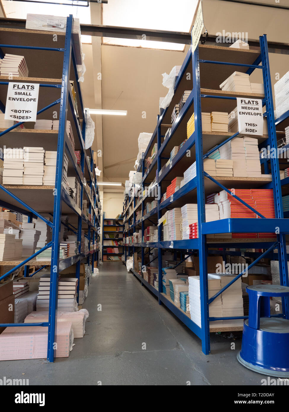 Shelves in warehouse stacked with books awaiting sale and dispatch through an online marketing site, 'A Great Read'. Based in Westbury, Wiltshire, UK. Stock Photo
