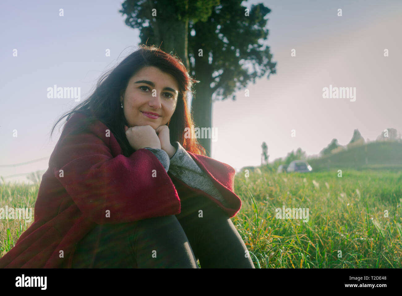 Girl sitting on top hill hi-res stock photography and images - Alamy