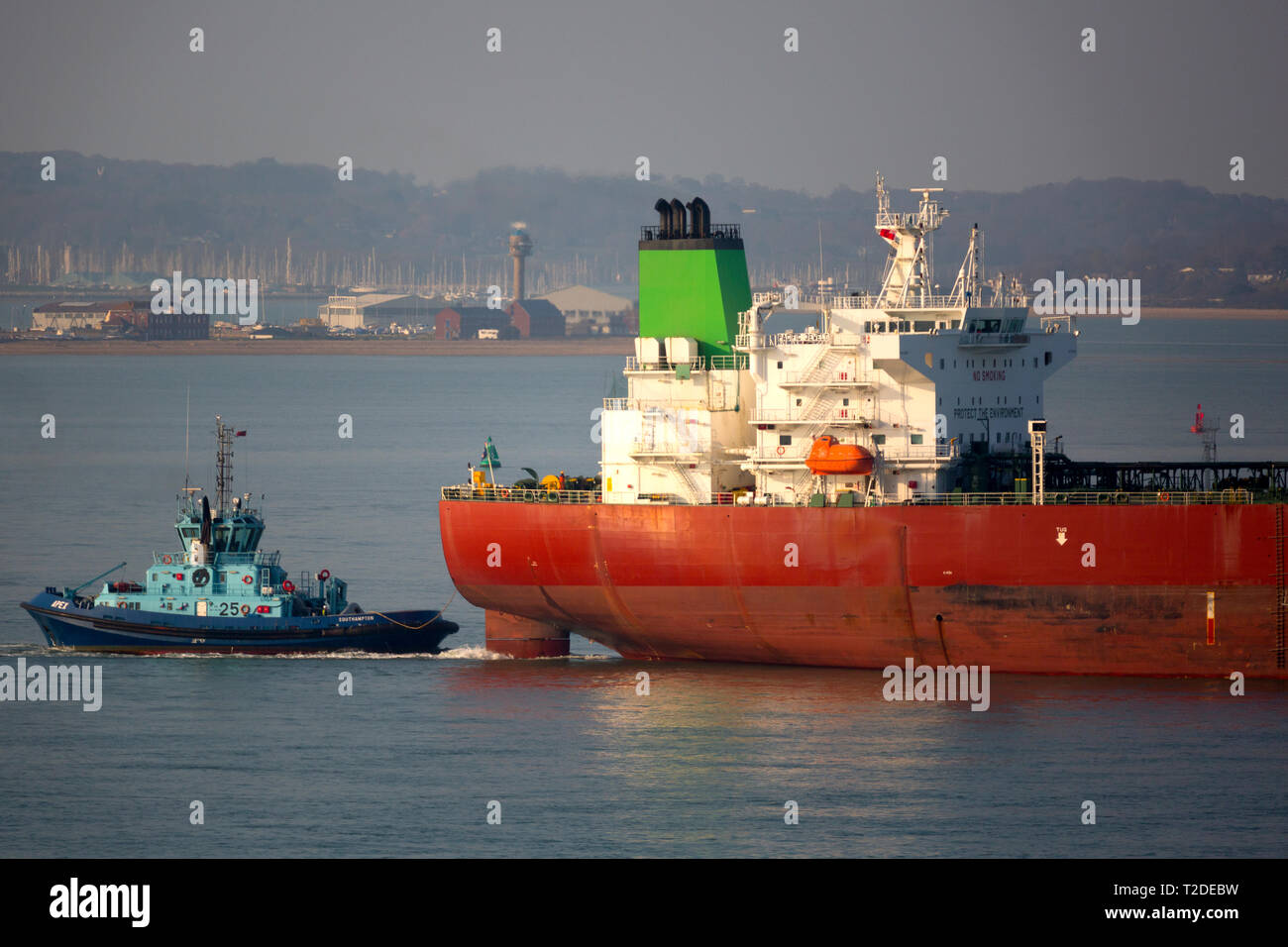 tow,assist,Oil,Tanker,Pacific,Jewels,Voith tractor tug,services,ABP,Southampton,Water,port,Fawley,Oil,Refinery,The Solent,Cowes,Isle of Wight,UK, Stock Photo