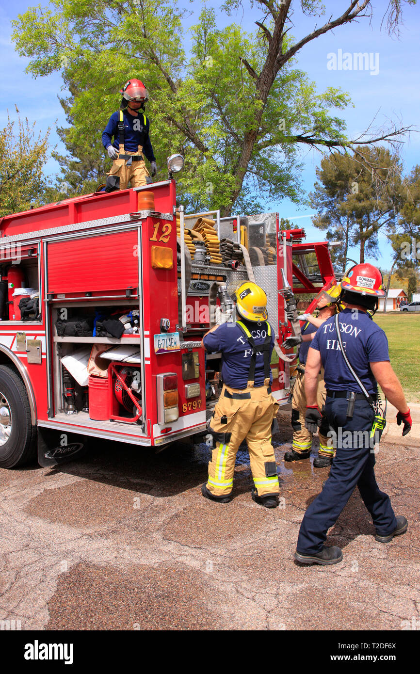 Firemen of the Tucson Fire Department finish up an emergency exercise