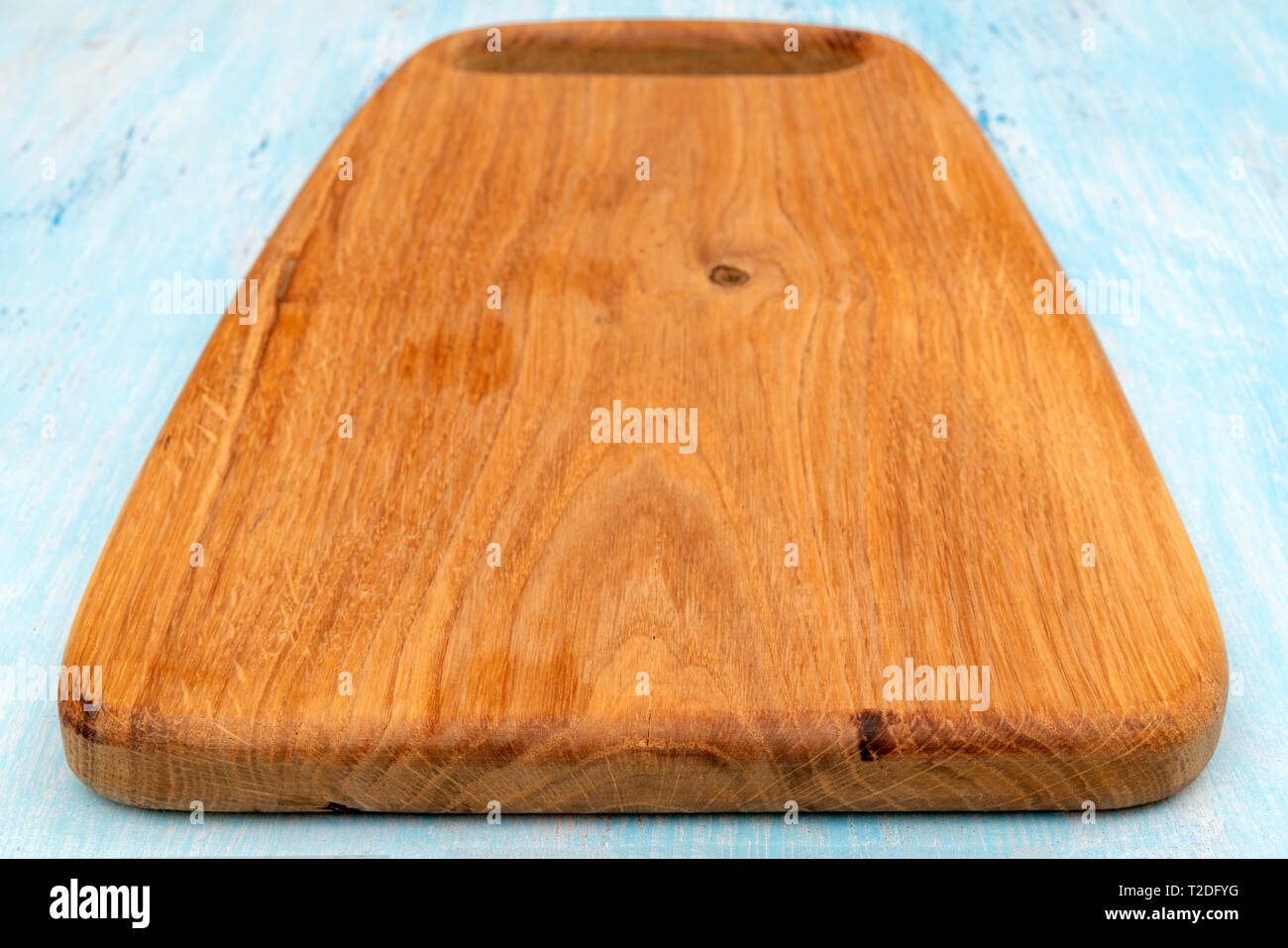 Wooden oak cutting board. Kitchenware. Copy space. Stock Photo