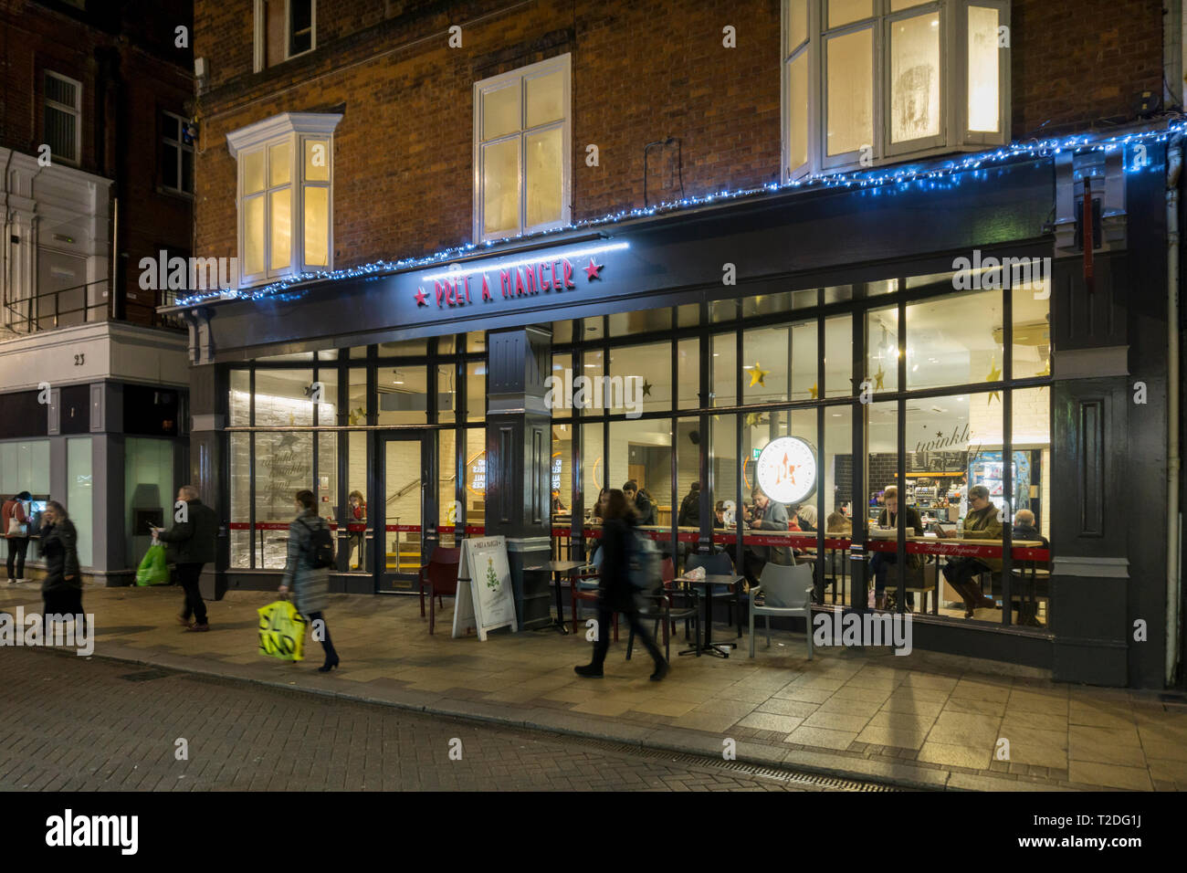A branch of Pret a Manger sandwich bars in Cambridge at dusk. Stock Photo