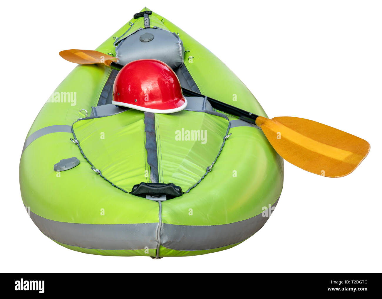 green inflatable whitewater one person kayak with a paddle and helmet  isolated on white Stock Photo
