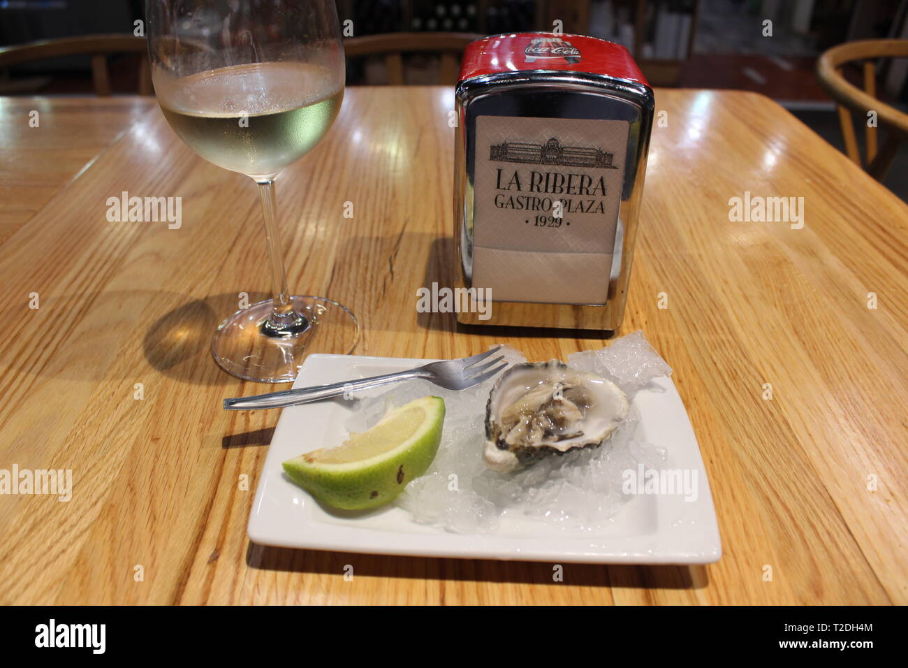 Oyster on ice and txakoli white wine Stock Photo