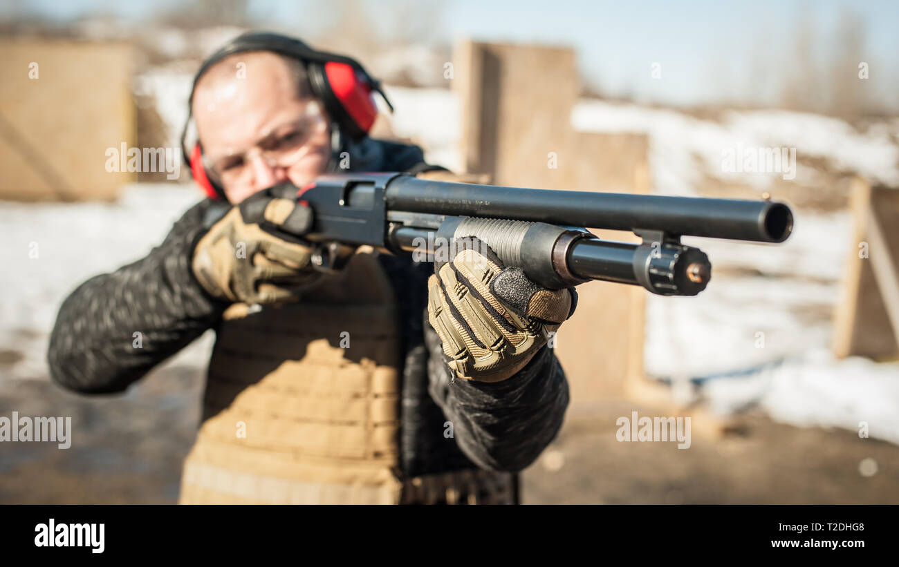 Combat shotgun shooting training. Long gun, pump gun and scattergun action course. Shooting