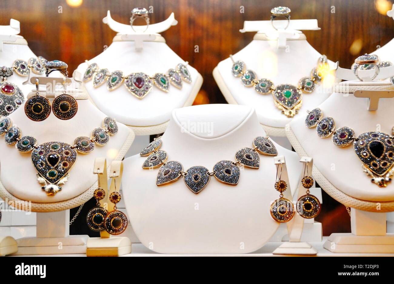 Fashion jewelry from  gold with black diamonds, on a window shop Stock Photo
