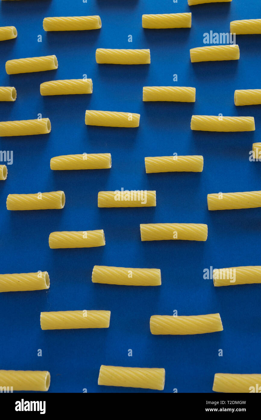 Abstract food background, Italian pasta products on blue background ...