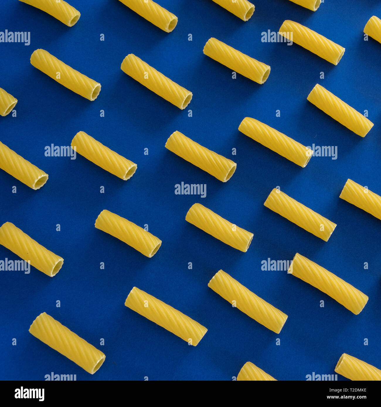 Abstract food background, Italian pasta products on blue background ...