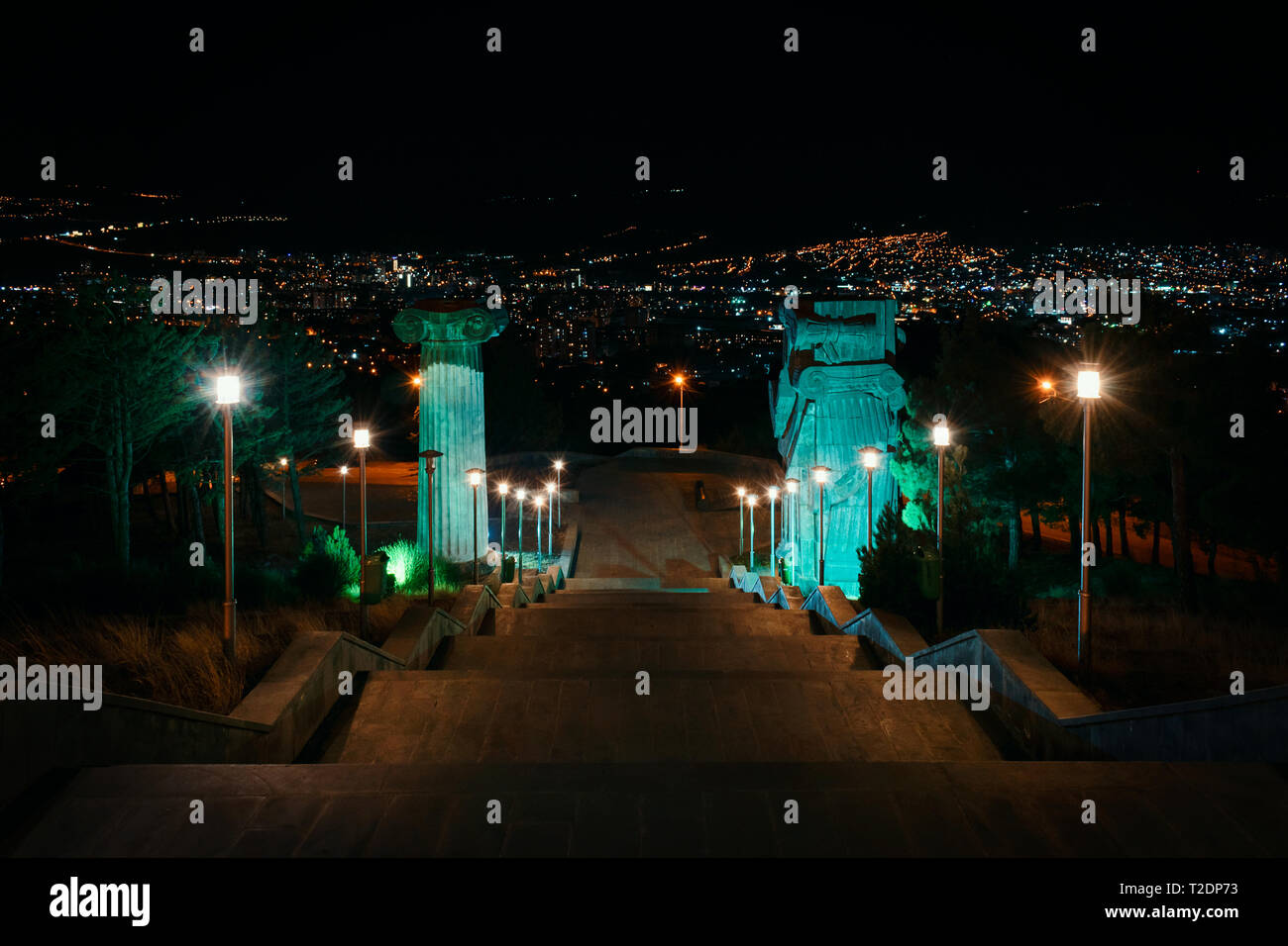 Georgia, Tbilisi - 05.02.2019. - View from the staircase of impressive monument Chronicles of Georgia on top of the hill. Outskirts of the city. Night Stock Photo