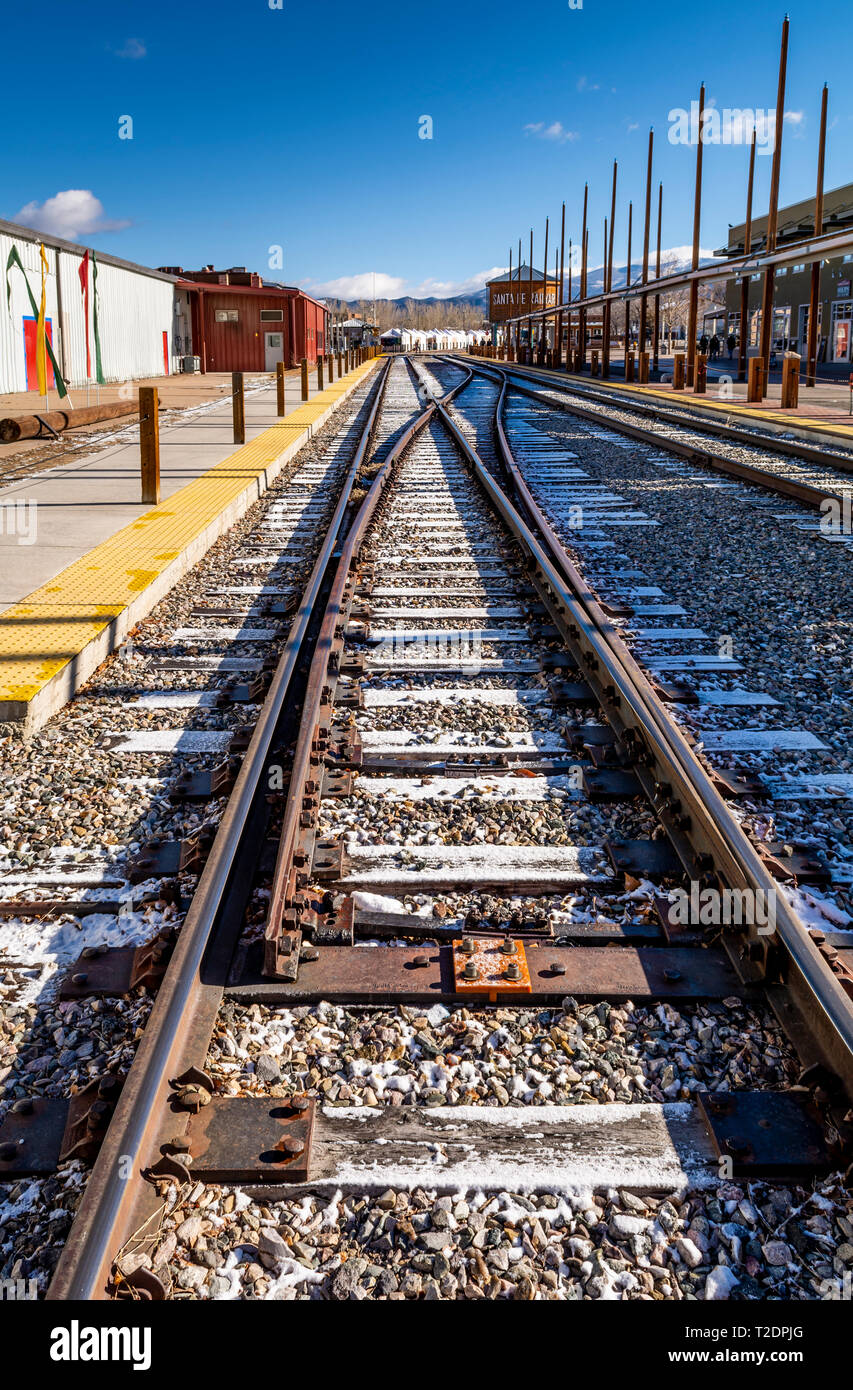 Railrunner commuter train tracks with snow in Santa Fe, New Mexico, USA. Stock Photo