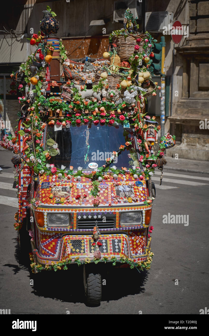 Palermo, Italy - October, 2018. An Ape Piaggio decorated as a colourful traditional Sicilian cart. Stock Photo