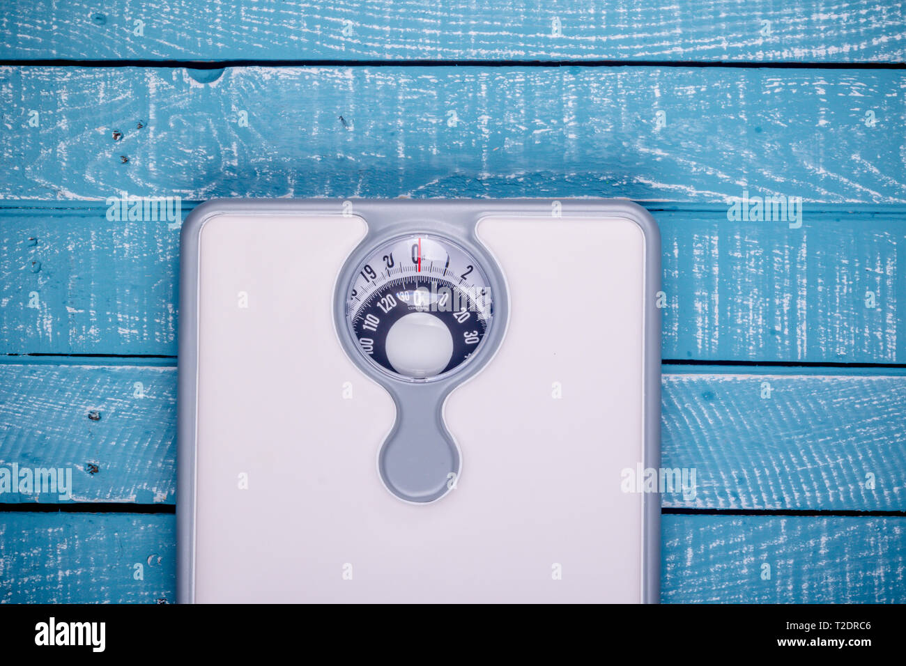 Weight loss concept showing a bathroom scales Stock Photo