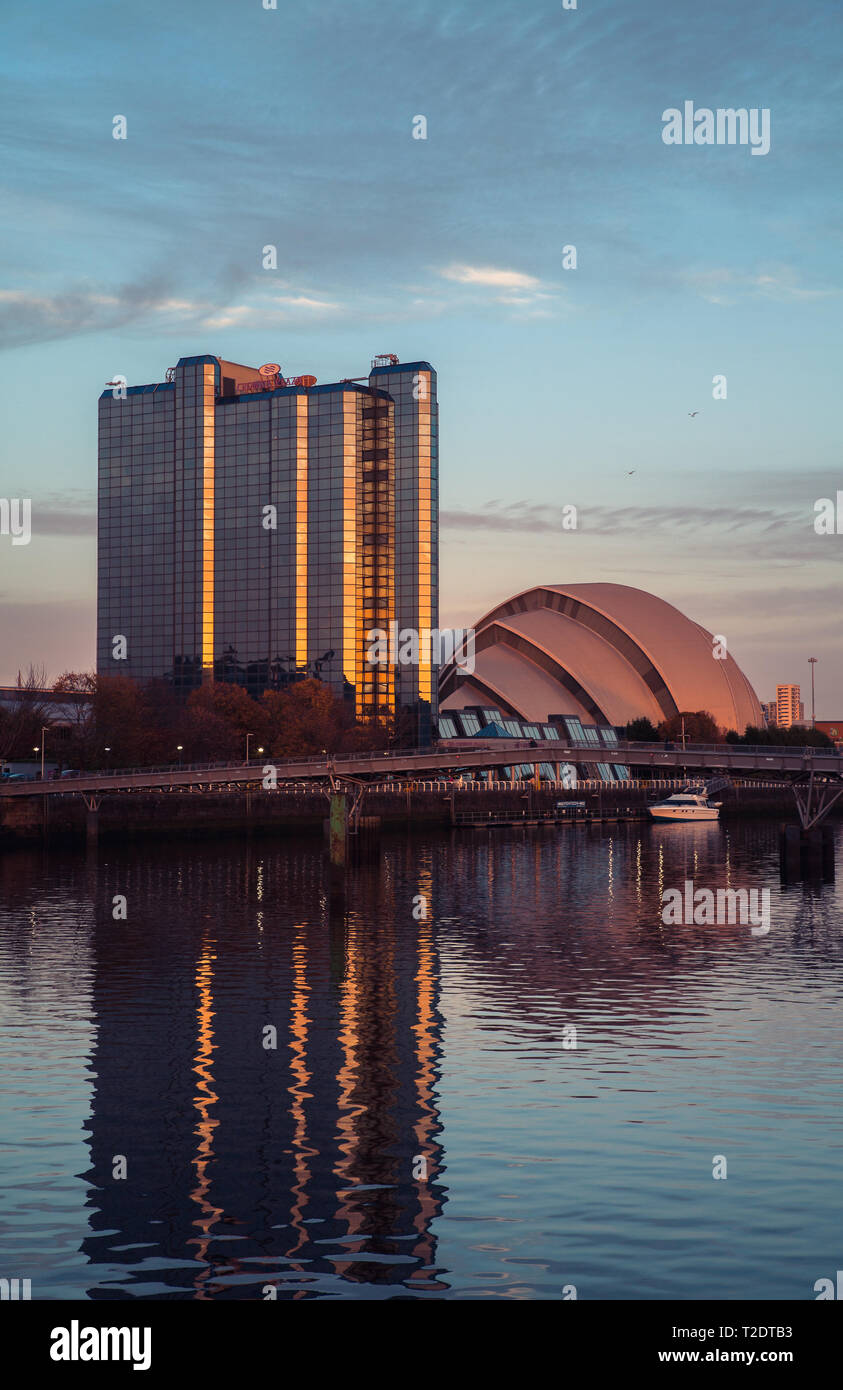 Glasgow Scotland SEC Centre at Pacific Quay as the sun goes down. Reflection in the river Clyde. Stock Photo