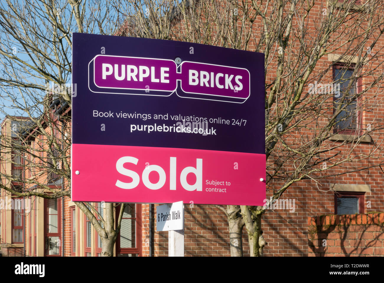 Purple Bricks Sold Sign Stock Photo