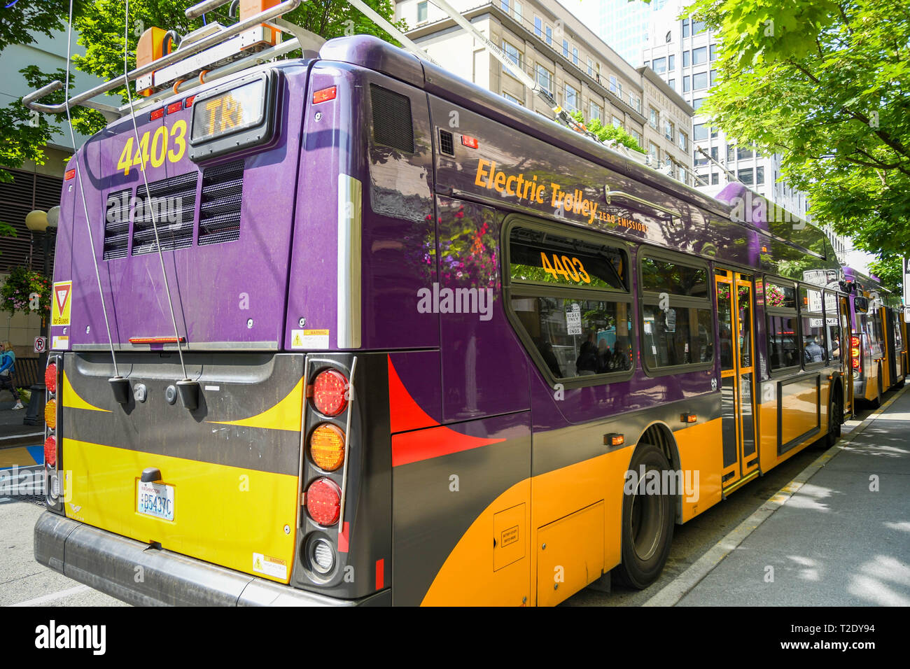 SEATTLE, WASHINGTON STATE, USA - JUNE 2018: Rear view of a zero emissions electric trolley bus on a street in Seattle city centre. Stock Photo