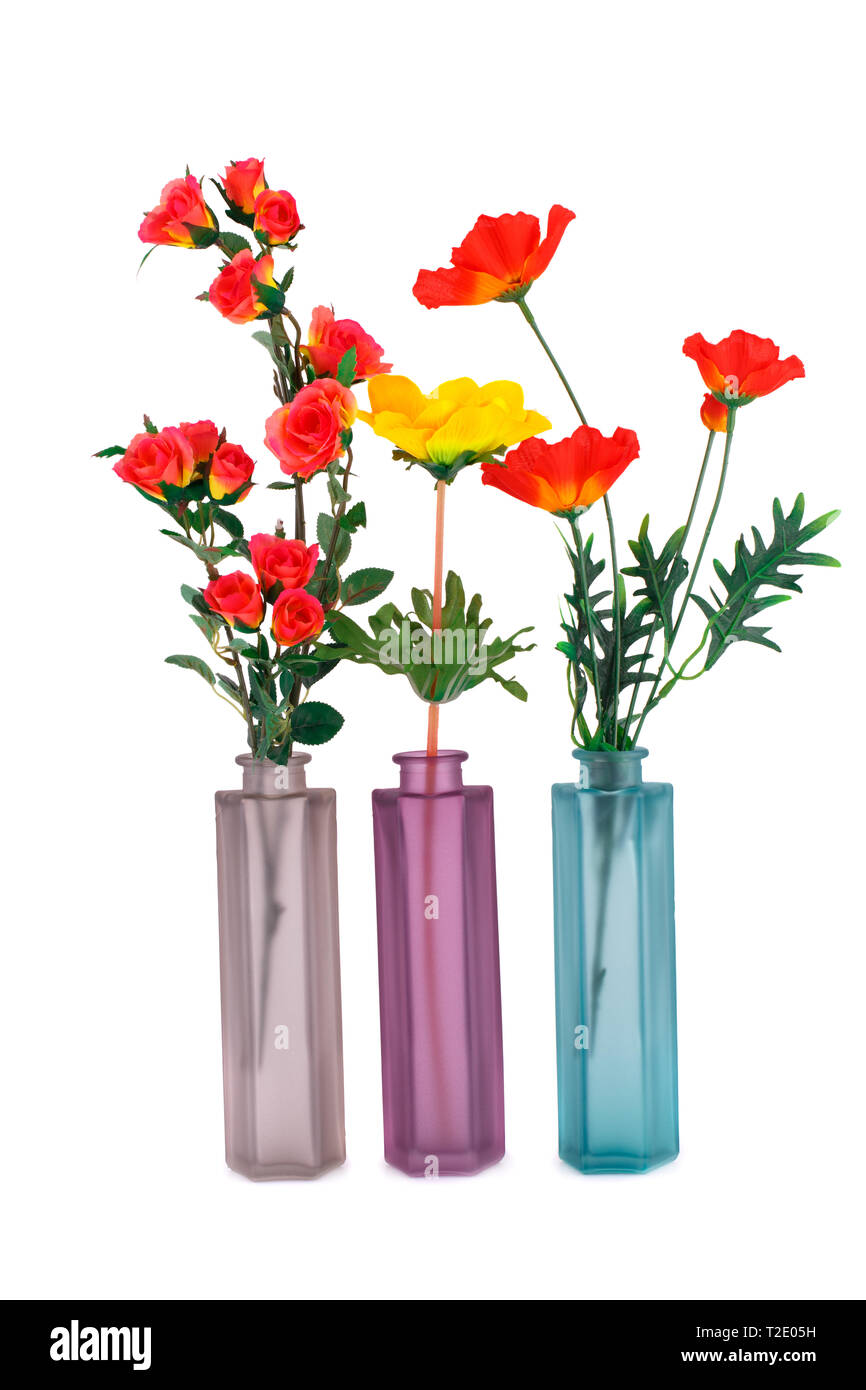 Colorful fabric flowers in glass vases isolated on white background Stock Photo Alamy