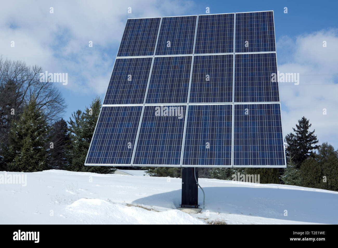 Pole mounted residential solar panel array, rated at 2.6 KW with 12 photovoltaic solar panels. Stock Photo