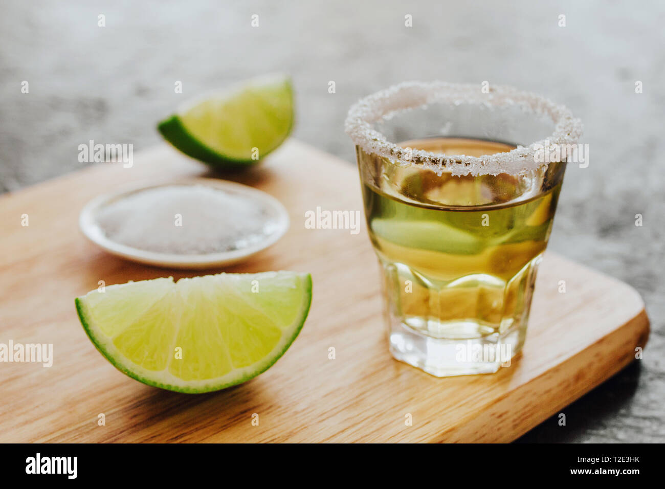 Tequila shot, mexican Alcoholic strong drinks and pieces of lime with salt in mexico Stock Photo