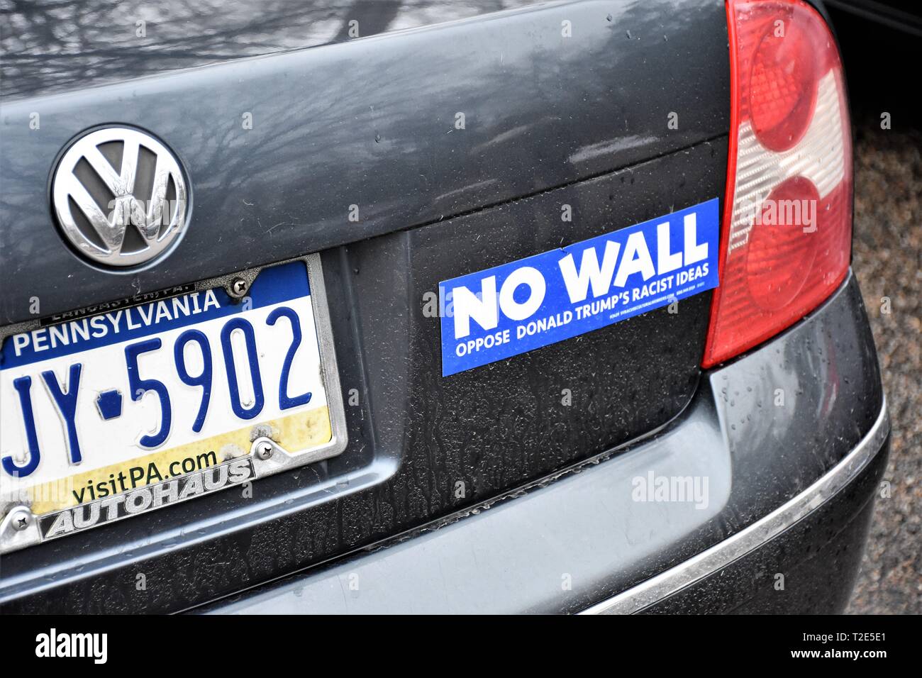 Bumper sticker on Pennsylvania car which is anti-Trump and pro immigration during time of Covid 19 President Trump backlash Stock Photo