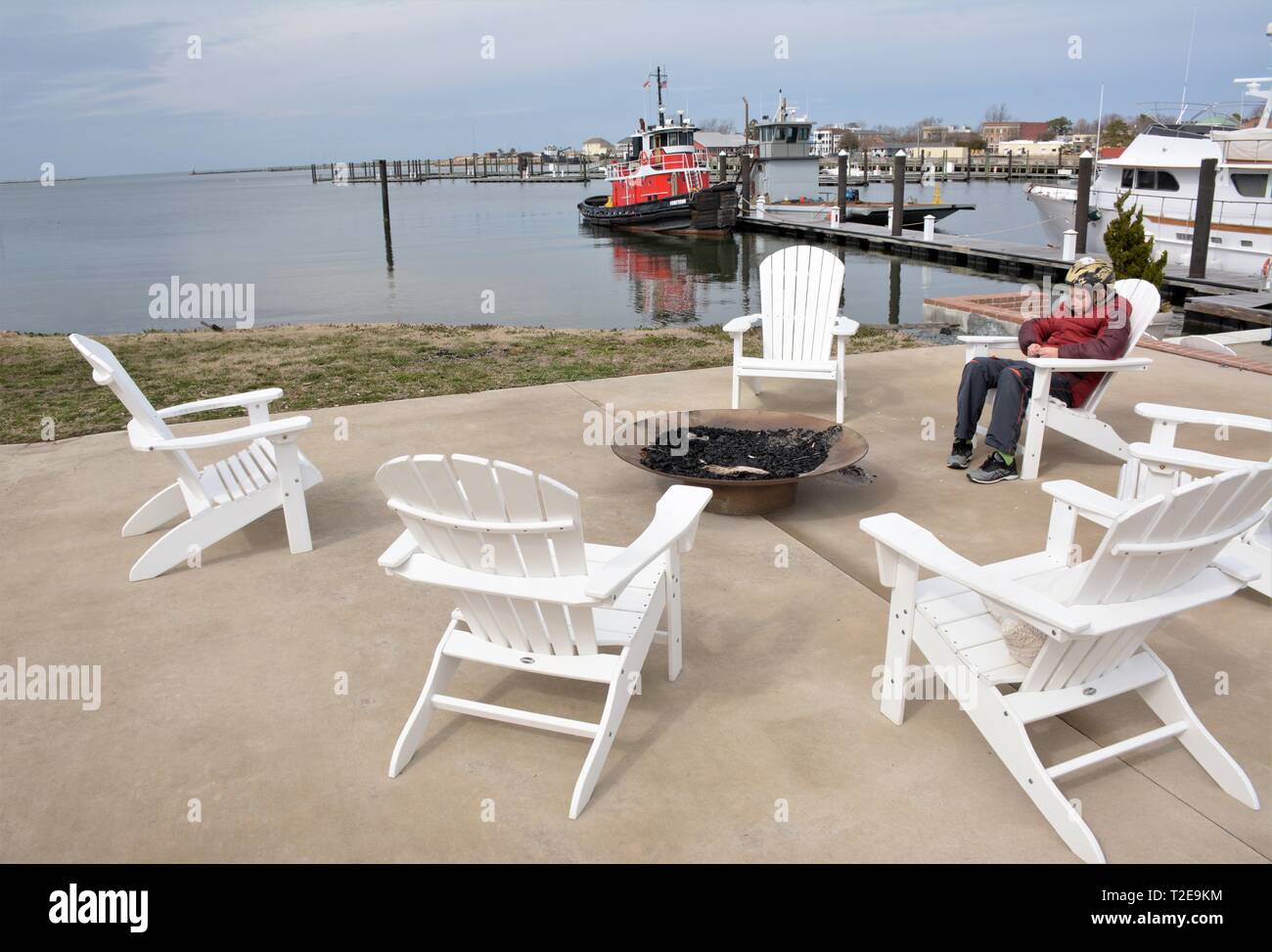 Real red tug boat docked at Cape Charles Virginia USA in fishing and container public boating