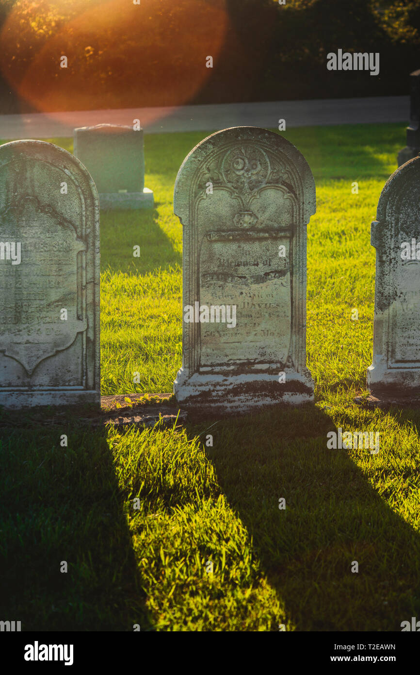 Tombstones at an old abandoned cemetery by the road Stock Photo Alamy