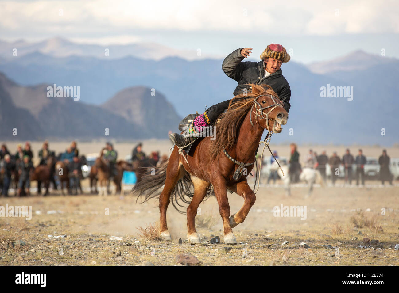 bayan Ulgii, Mongolia, 3rd October 2015: kazakh men on their horses in a landscape of western mongolia Stock Photo