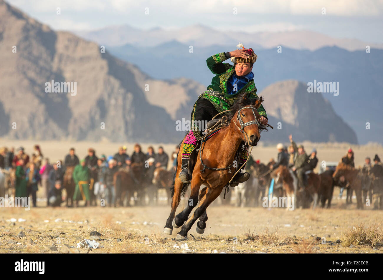 bayan Ulgii, Mongolia, 3rd October 2015: kazakh men on their horses in a landscape of western mongolia Stock Photo