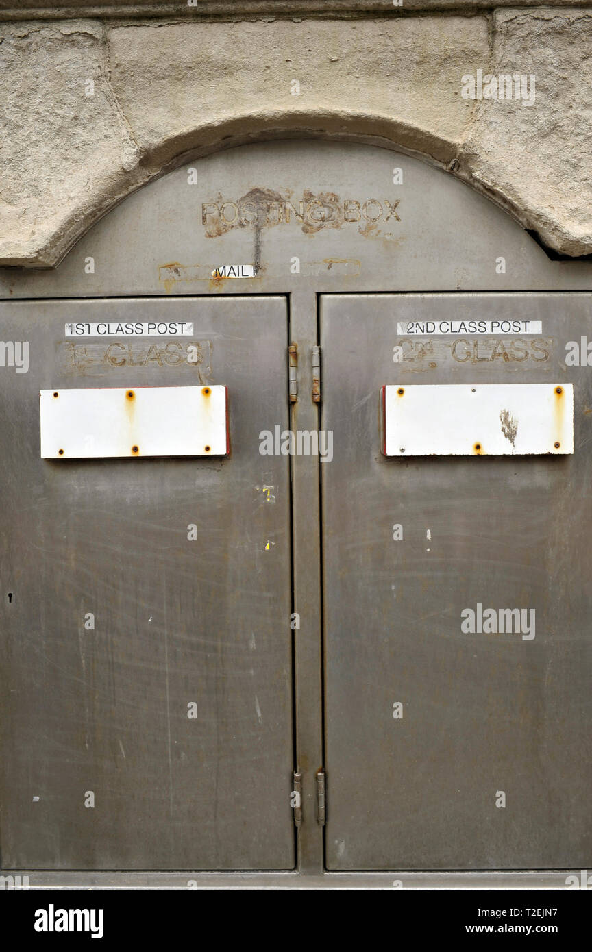 Sealed post boxes in the wall of redundant post office,UK Stock Photo