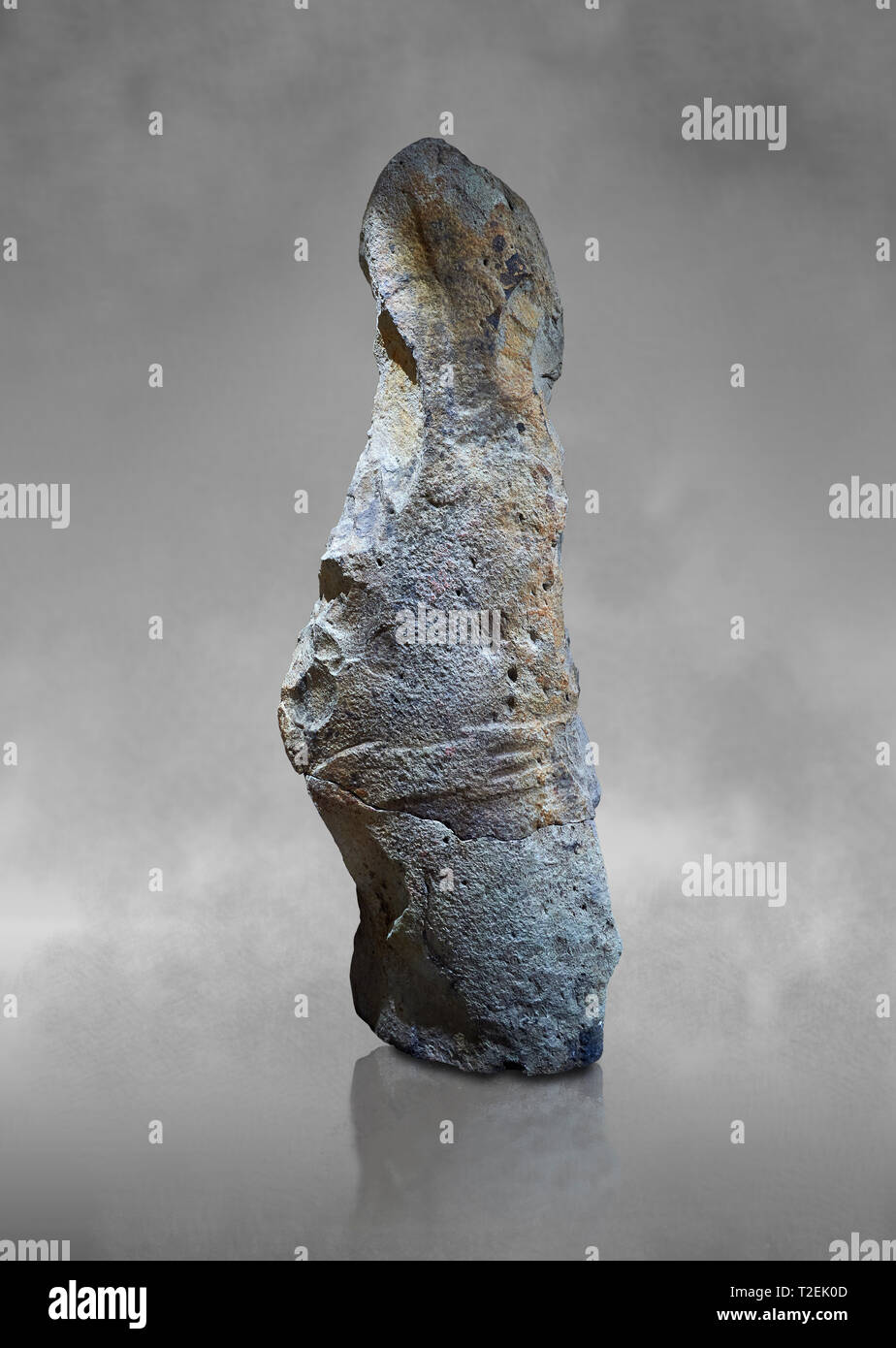 Late European Neolithic prehistoric Menhir standing stone with carvings on its face side. The remains of a representation of a stylalised male figure  Stock Photo