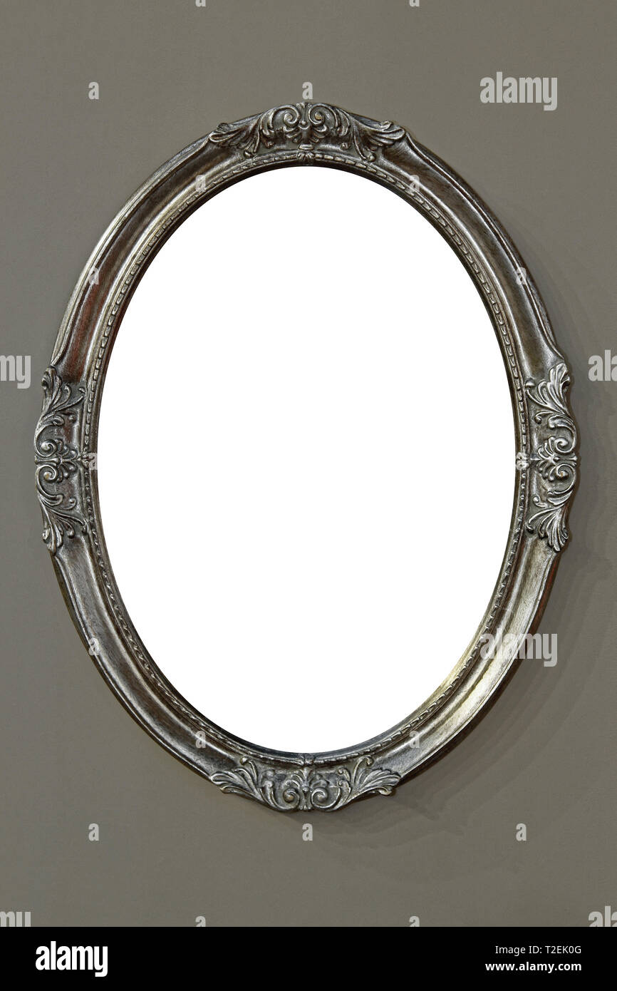 Decorative Oval Mirror Frame Hanging on Wall Stock Photo Alamy