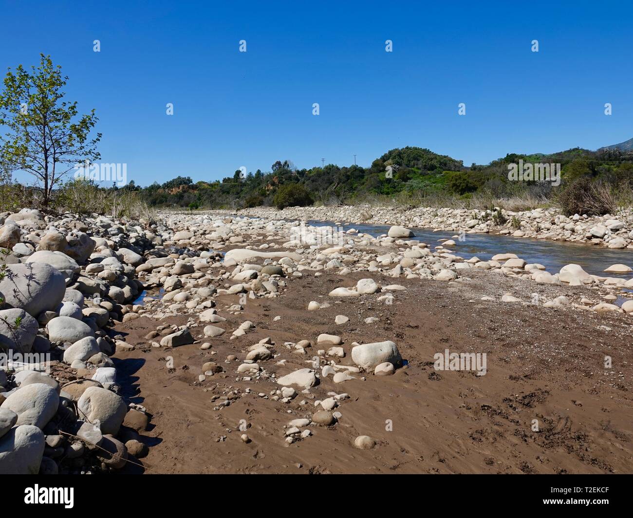 Large rocks, stones, line the edges of the Ventura River, Ojai