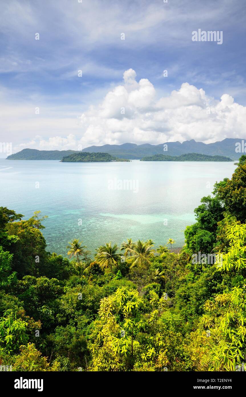 Aerial view on the tropical island, turquoise sea, mountains, blue sky and scenic clouds at the Koh Chang island, Thailand. Stock Photo