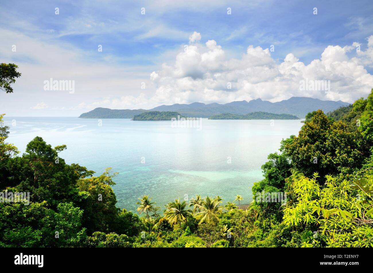 Aerial view on the tropical island, turquoise sea, mountains, blue sky and scenic clouds at the Koh Chang island, Thailand. Stock Photo