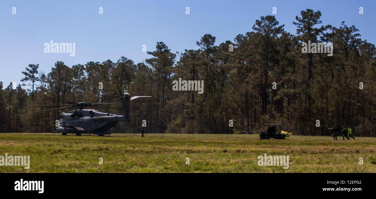 A CH-53 Super Stallion prepares to evacuate a casualty during Dutch bilateral training at Camp Lejeune, N.C., March 29, 2019. Bilateral training between the U.S. Marine Corps and the Royal Dutch Marines strengthens existing interoperability between the two nations and improves counternarcotic and anti-terrorism capabilities. (U.S. Marine Corps photo by Lance Cpl. Nello Miele) Stock Photo