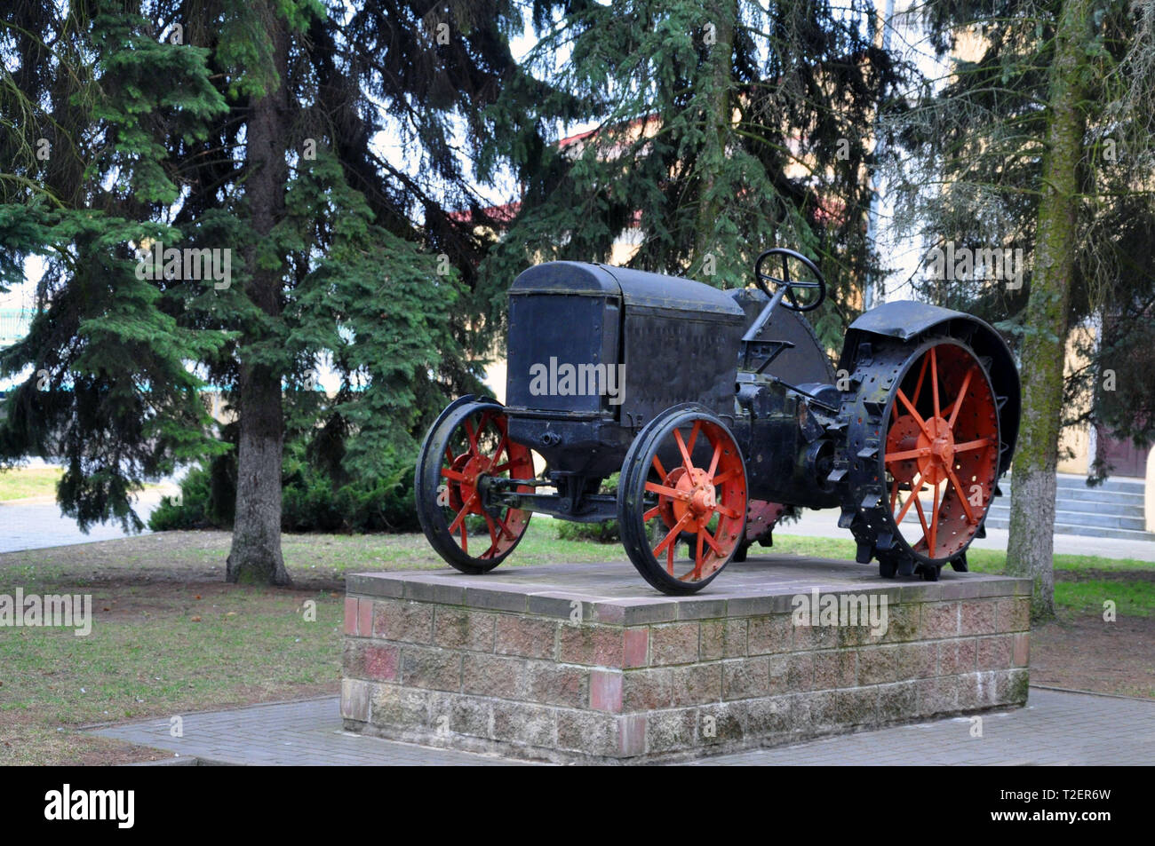 The first Soviet tractor on a pedestal in the city of Pinsk, Republic of Belarus Stock Photo