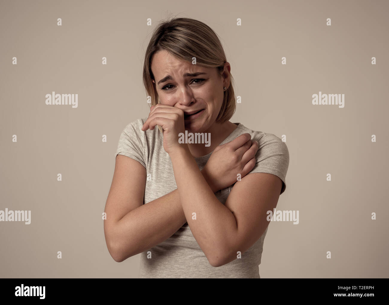 Portrait of young sad depressed woman crying, looking miserable and hopeless. Feeling sorrow, grief and fear. In People, mental health, broken heart,  Stock Photo