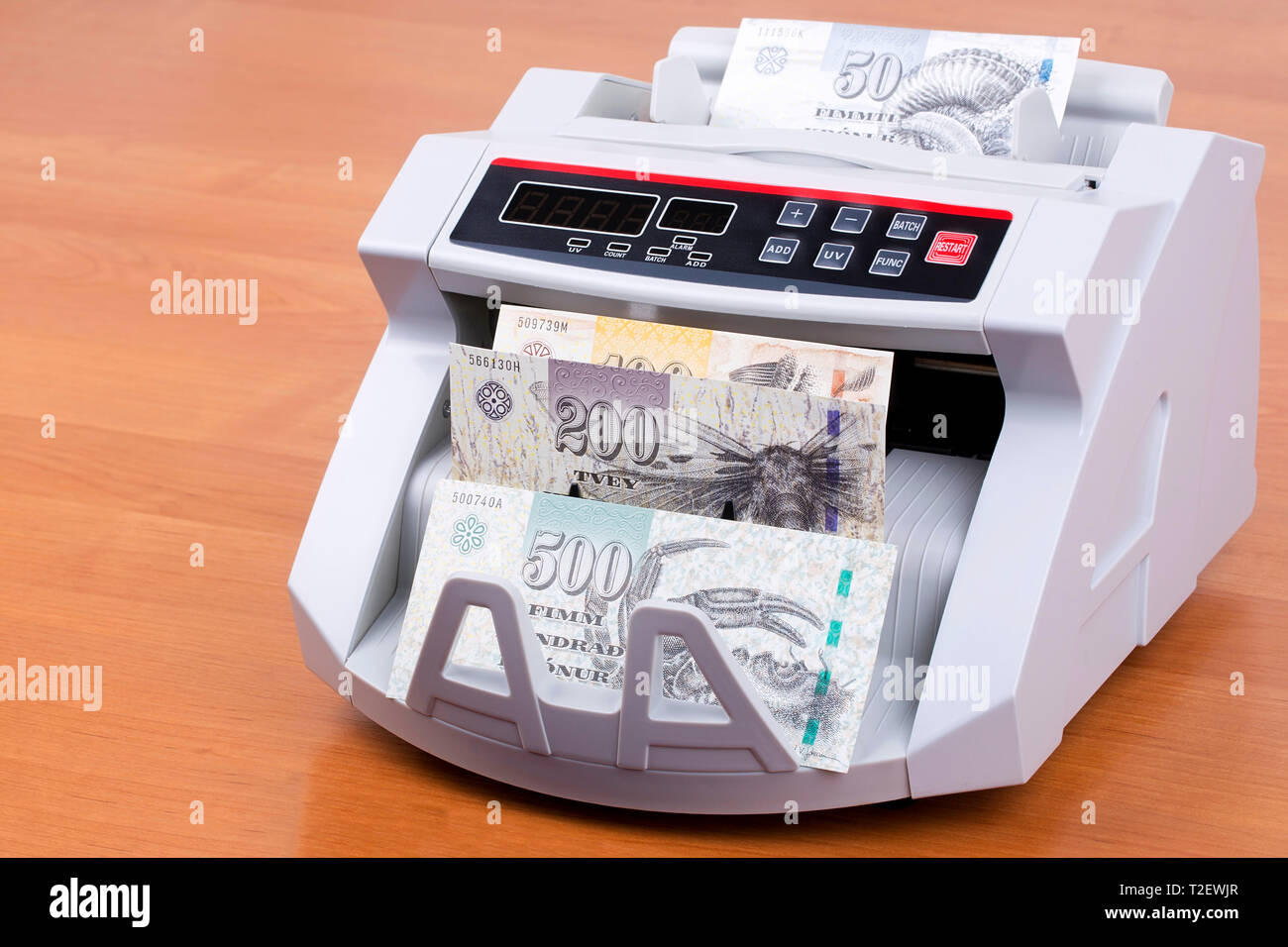 Money from Faroe Islands in a counting machine Stock Photo