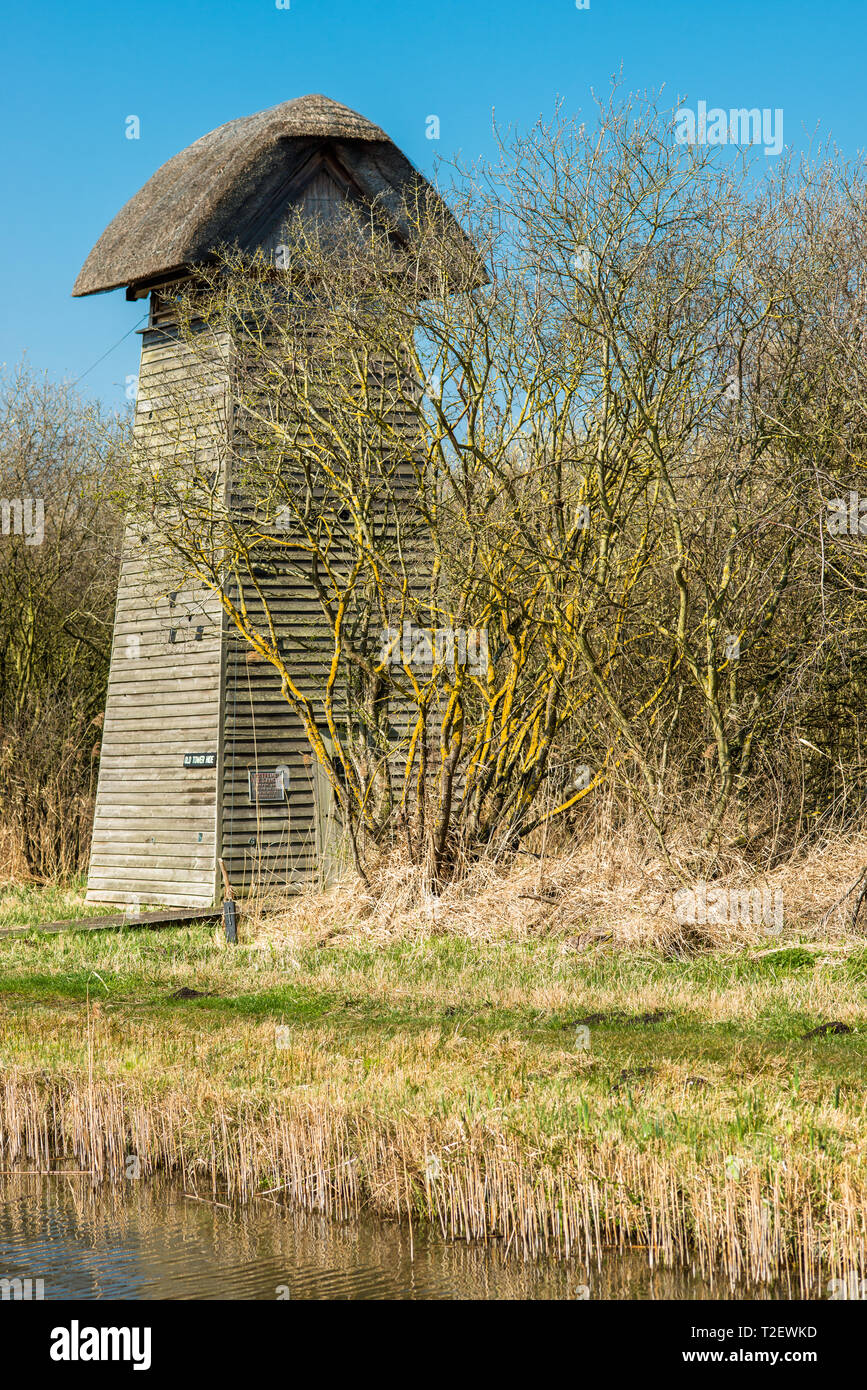 The Tower hide on the banks of Burwell Lode waterway on Wicken Fen nature reserve, Cambridgeshire; England; UK Stock Photo