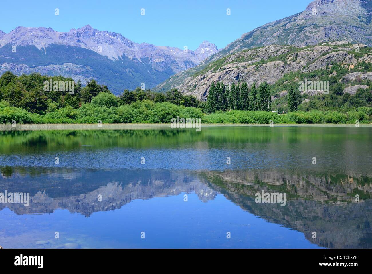Mountain scenery reflected in the water of the Rio Futaleufu, region de los Lagos, Patagonia, Chile Stock Photo