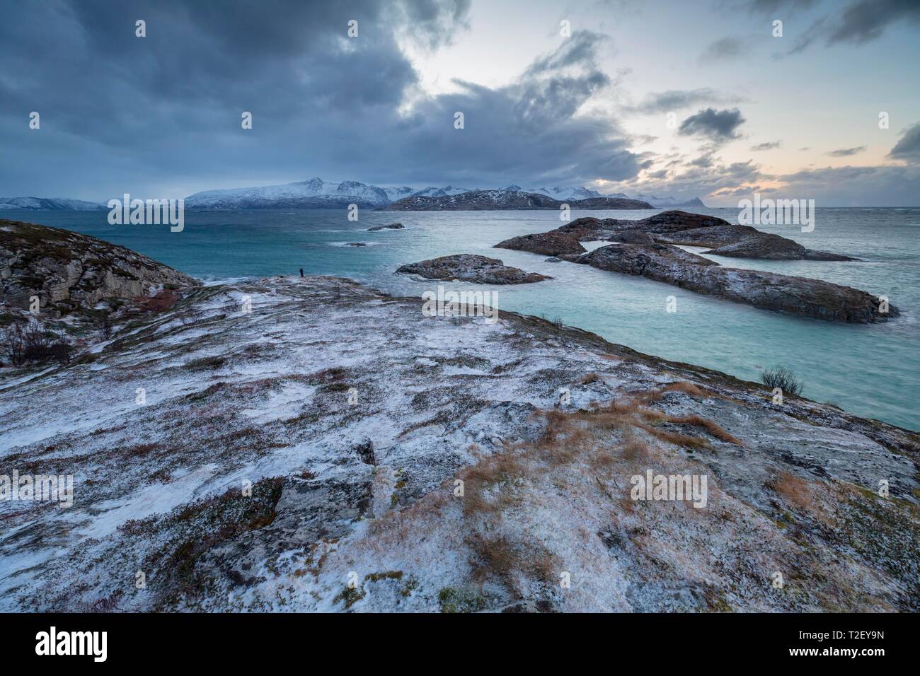 Dark clouds over the sea, coastal landscape in winter, island Sommaroy, Hillsoya, Tromso, Troms, Norway Stock Photo