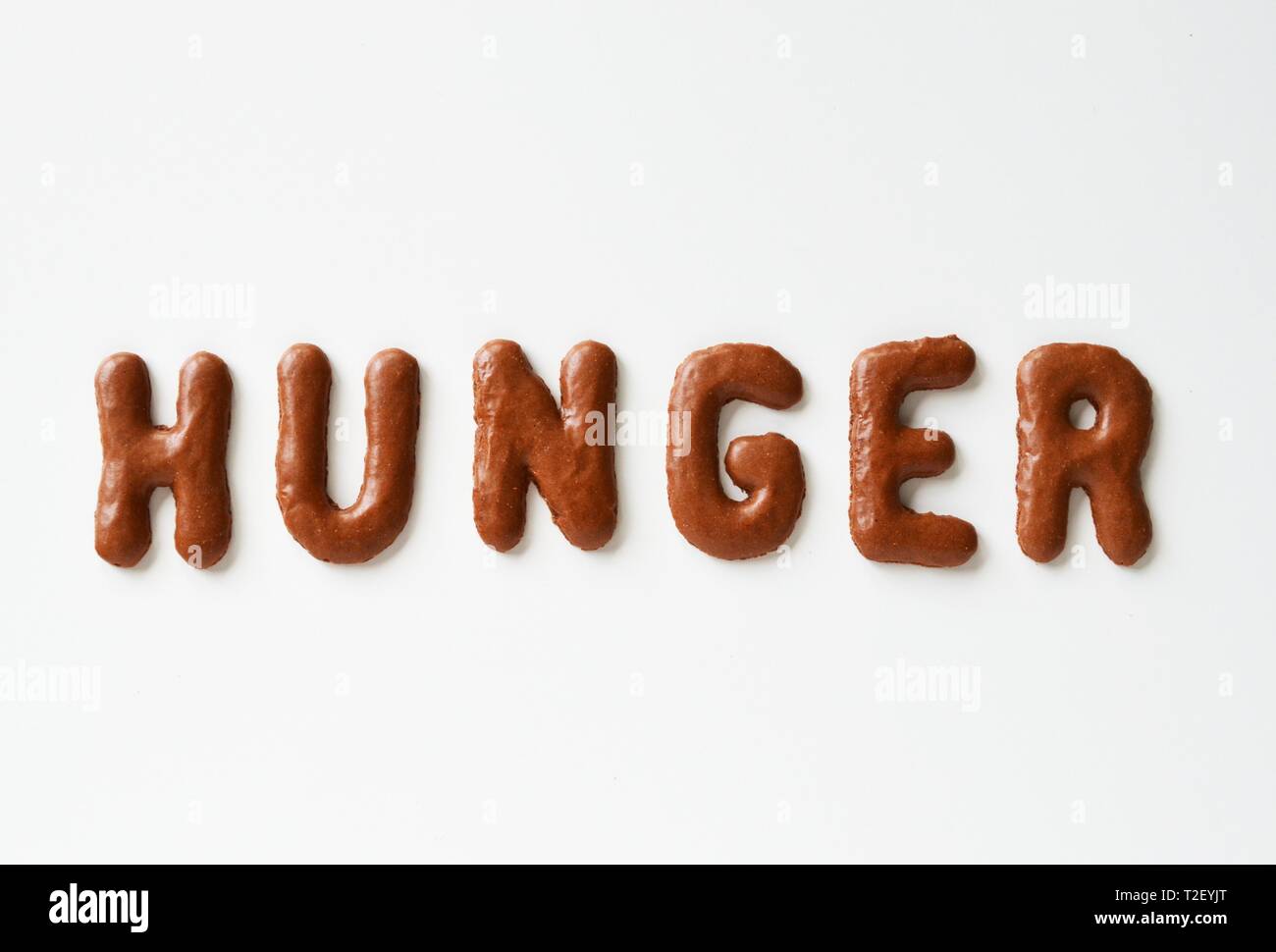 Hunger lettering written with alphabet biscuits, Germany Stock Photo ...