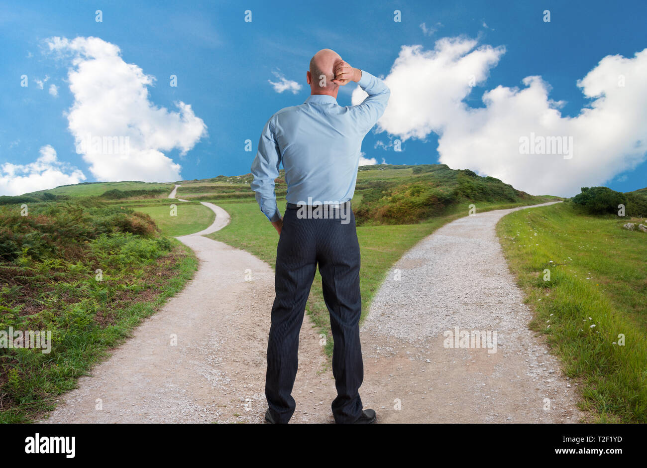 man at fork in the road concept image Stock Photo