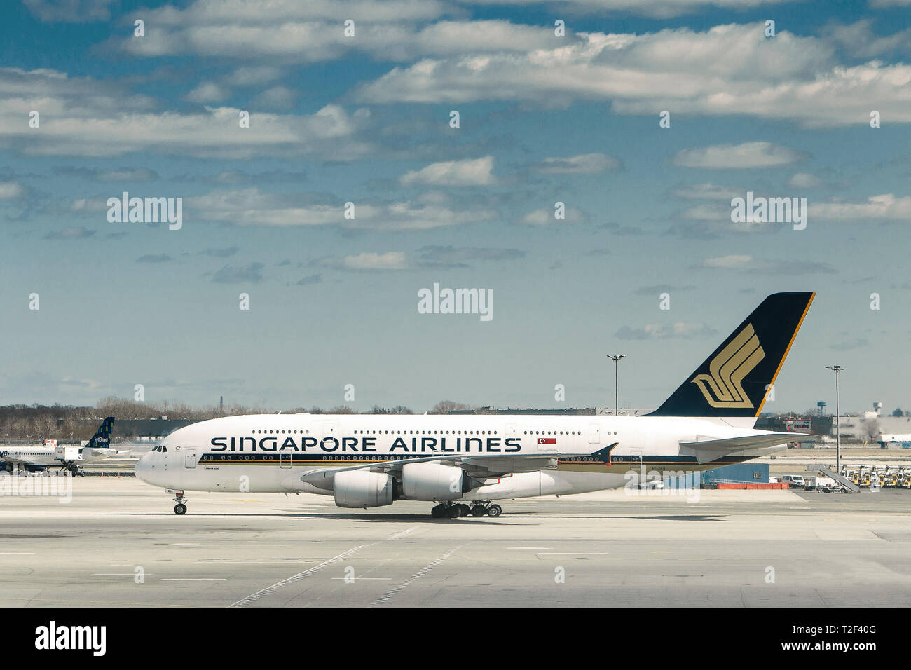 New York, 3/17/2019: Singapore Airlines commercial jet is maneuvering on the tarmac at JFK airport. Stock Photo