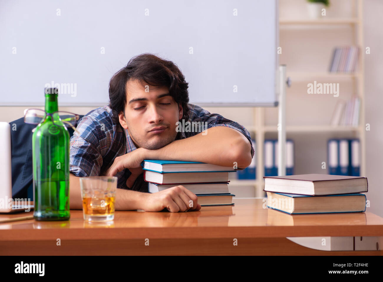 Male teacher drinking in the classroom Stock Photo Alamy