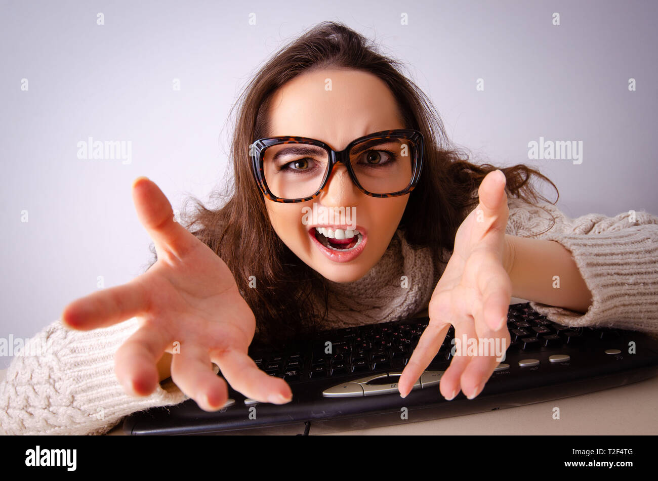 Funny nerd girl working on computer Stock Photo - Alamy