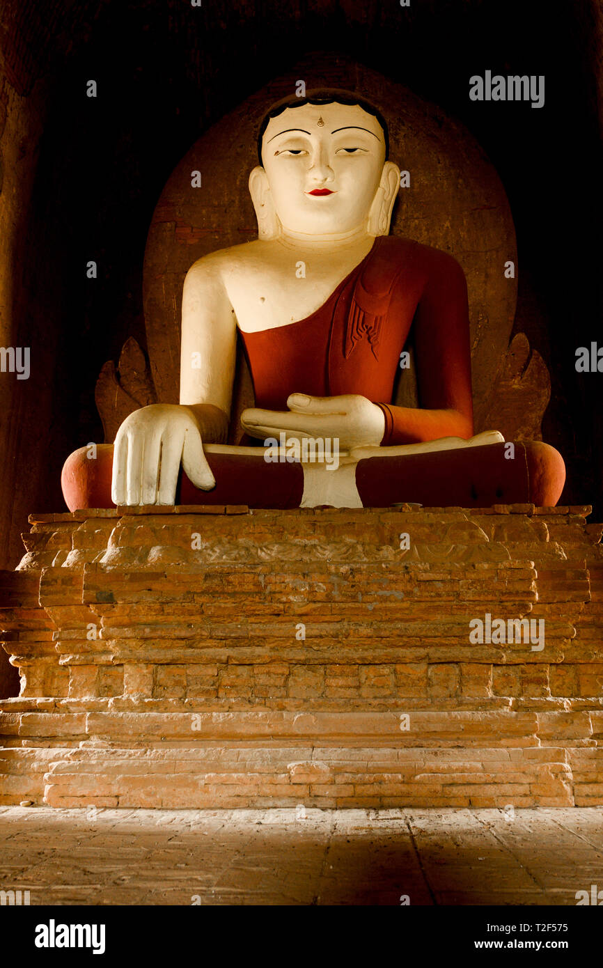 Buddha Statue Seated In A Full Lotus Position Illuminated By The buddha-statue-seated-in-a-full-lotus-position-illuminated-by-the