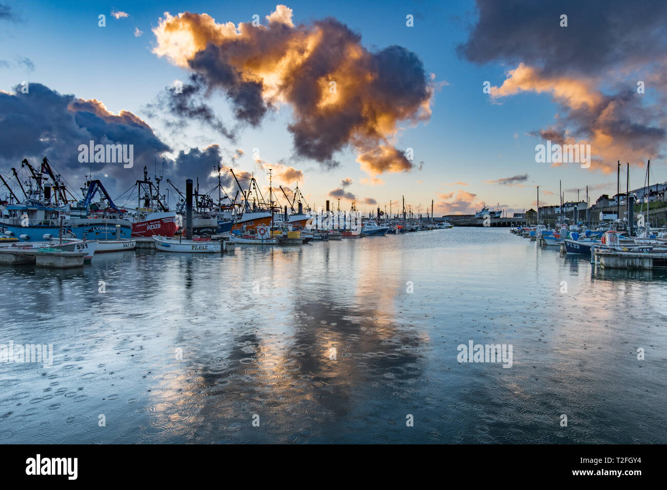 Newlyn, Cornwall, UK. 2nd April 2019. UK Weather. Early morning showers over the harbour at Newlyn. The forecast for Cornwall for the day is a mix of sunshine and wintry showers. Credit: Simon Maycock/Alamy Live News Stock Photo