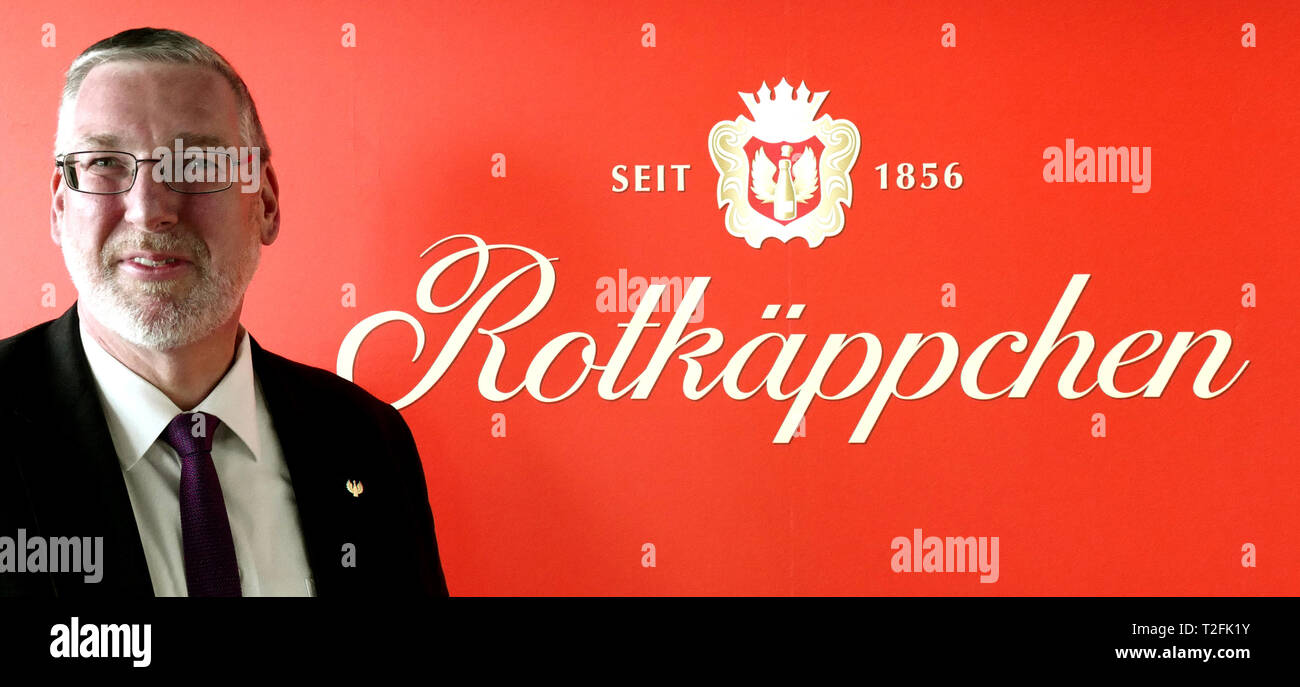 Leipzig, Germany. 02nd Apr, 2019. Mike Eberle, the new managing director for production, quality management, technology and purchasing, stands in front of a wall with the logo and lettering "Little Red Riding Hood" on the "Bilanz-Pk" of Rotkäppchen-Mumm Sektkellereien GmbH. Eberle takes office at the turn of the month. The company provided information on the business figures for 2018 and an outlook for the 2019 financial year. Credit: Peter Endig/dpa/Alamy Live News Stock Photo